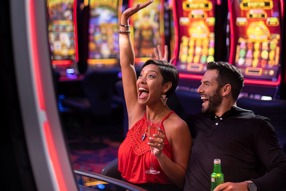 excited people playing slots